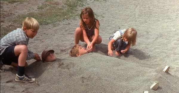 five kids on the beach